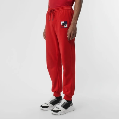 Shop Burberry Chequer Ekd Cotton Trackpants In Military Red