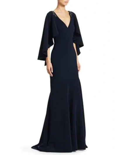 Shop Theia Embellished Cape-sleeve Mermaid Gown In Navy