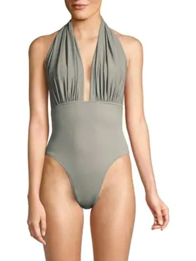 Shop Norma Kamali Halter Low Back One-piece Swimsuit In Stone