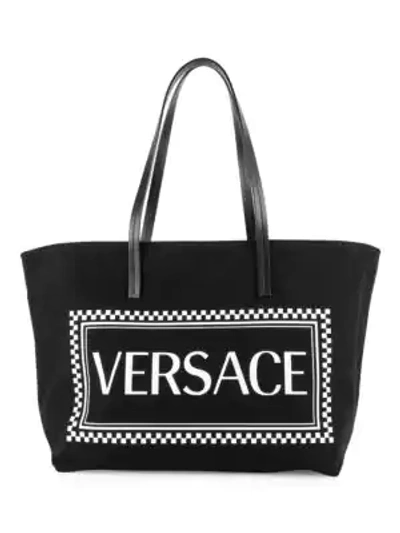 Shop Versace Canvas Stamp Logo Tote In Black