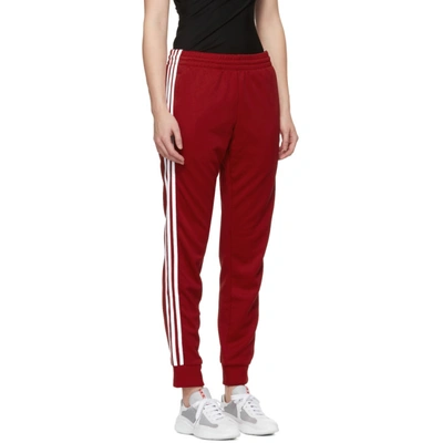 Shop Adidas Originals Red Sst Track Pants In Power Red
