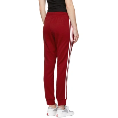 Shop Adidas Originals Red Sst Track Pants In Power Red