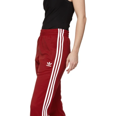 Shop Adidas Originals Red Sst Track Pants In Power Red