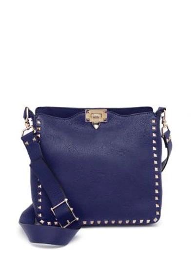 Shop Valentino Small Rockstud Leather Hobo Bag In Marine