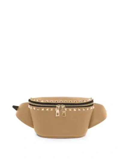 Shop Valentino Garavani Rockstud Leather Belt Bag In Camel