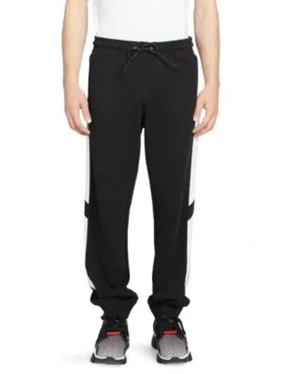 Shop Givenchy Reflective Tape Sweatpants In Black