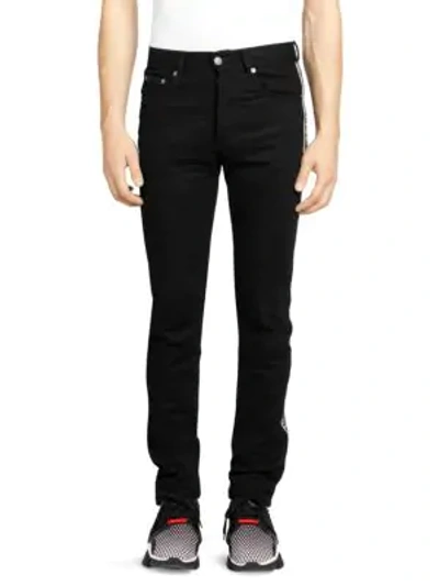 Shop Givenchy Side-tape Logo Jeans In Black