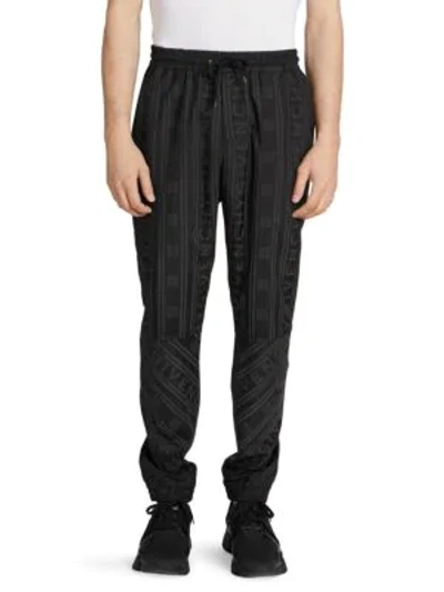 Shop Givenchy All-over Tonal Stripe Logo Joggers In Black
