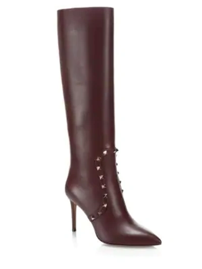 Shop Valentino Rockstud Leather Knee-high Boots In Rubin