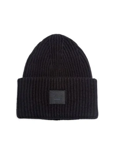 Shop Acne Studios Pansy L Ribbed Wool Beanie In Black