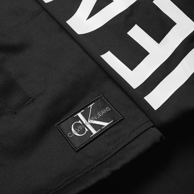 Shop Calvin Klein Institutional Logo Coach Jacket In Black