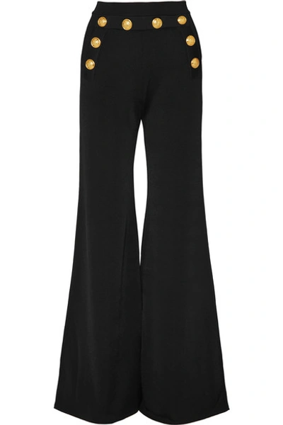 Shop Balmain Button-embellished Stretch-knit Flared Pants In Black