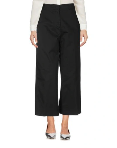 Shop Versace Cropped Pants & Culottes In Black