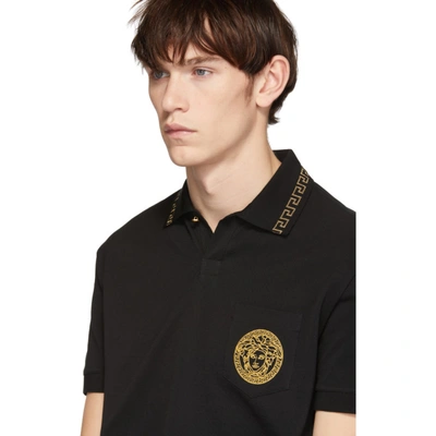 Shop Versace Black And Gold Round Medusa Polo In A92y Blk/go