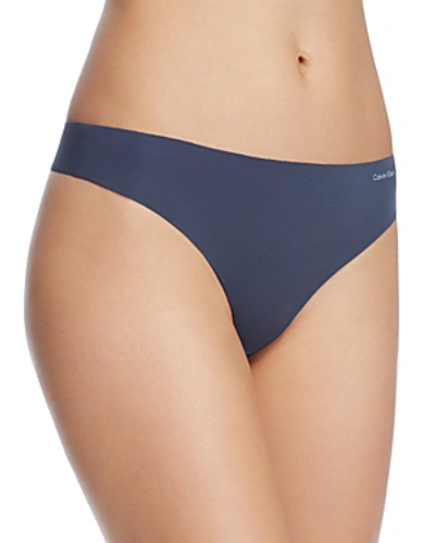 Shop Calvin Klein Invisibles Thong In Speakeasy