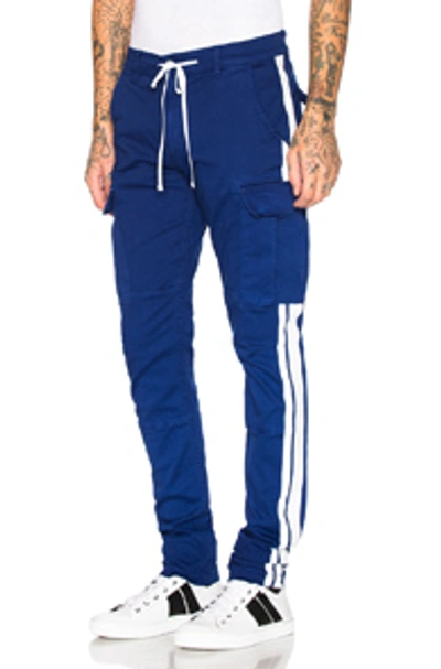 Shop Amiri Stack Track Cargo Pants In Royal Blue