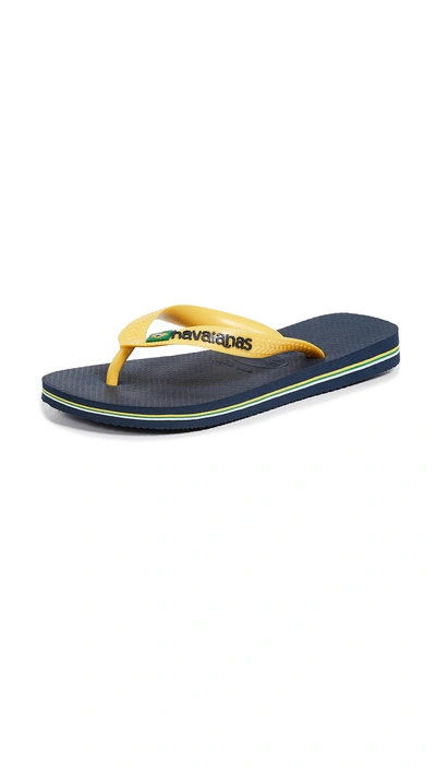 Shop Havaianas Brazil Logo Flip Flops In Navy Blue/citrus Yellow