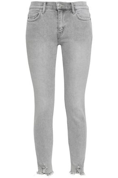 Shop Current Elliott Distressed Mid-rise Skinny Jeans In Light Gray