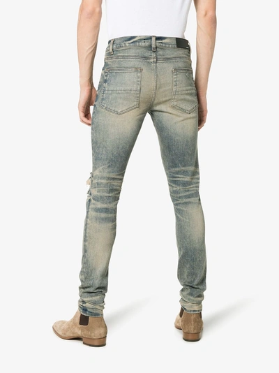 Shop Amiri Distressed Skinny Jeans In Blue