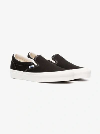 Shop Vans Black And White Ua Classic Slip-on Dx Cotton Sneakers