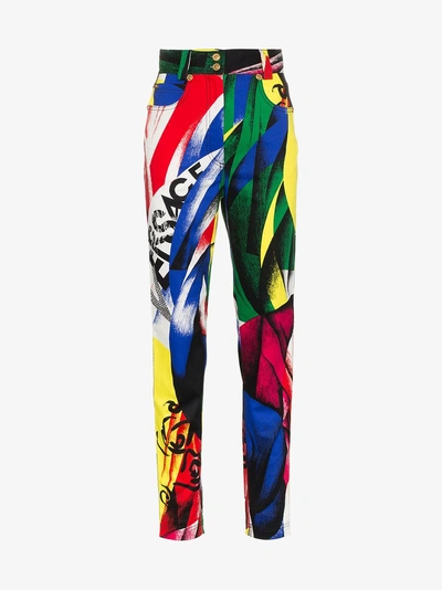 Shop Versace High-waisted Pattern Jeans In Multicolour