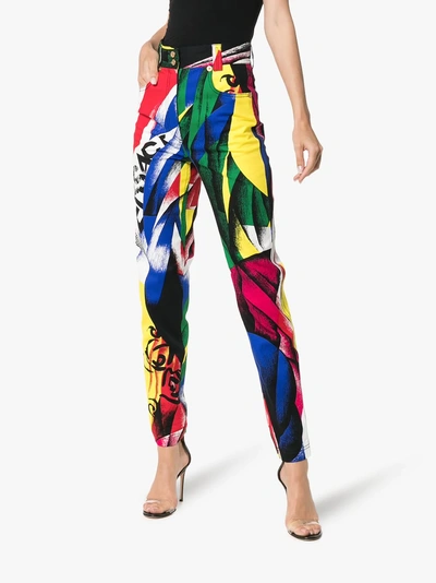 Shop Versace High-waisted Pattern Jeans In Multicolour