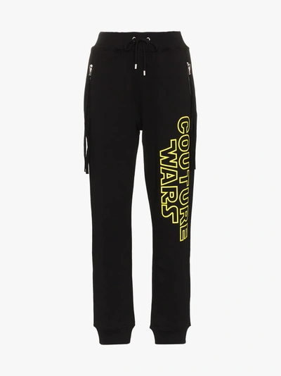 Shop Moschino Couture Wars Printed Cotton Track Pants In Black