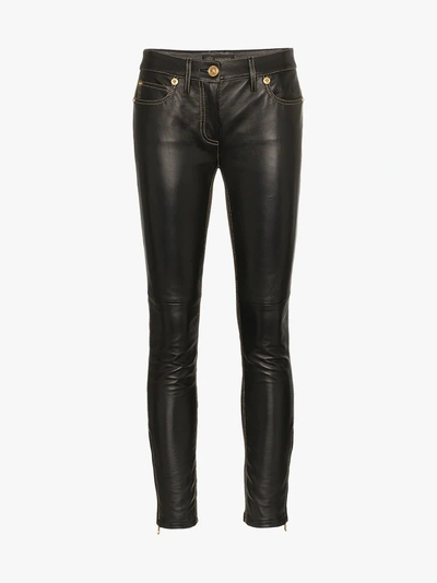 Shop Versace Slim Fit Trousers In Black