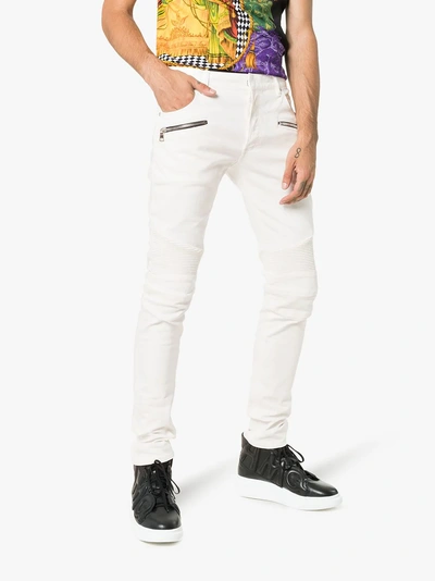 Shop Balmain Skinny Logo Patch Biker Jeans In White