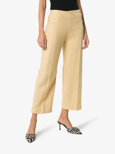 Shop Jacquemus Pleat Front Waist Detail Cotton Trousers In Pale Yellow