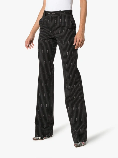 Shop Gucci Slim Fit Pin Stripe Trousers In Black