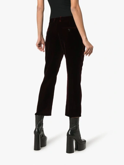 Shop Saint Laurent Burgundy Mid Rise Flared Velvet Trousers In Red