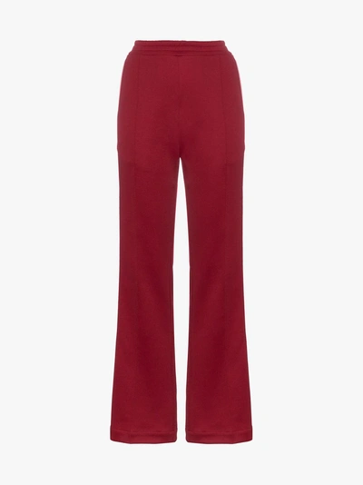 Shop Moncler Side Stripe Cotton-blend Track Pants In Red