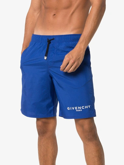 Shop Givenchy Logo Printed Swim Shorts In Blue