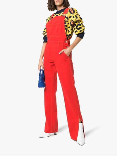 Shop Ganni Flared Denim Overalls In Red