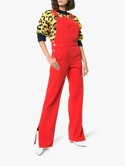 Shop Ganni Flared Denim Overalls In Red