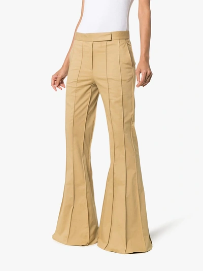 Shop Rosie Assoulin Corduroy Pleated Flare Trousers In Green