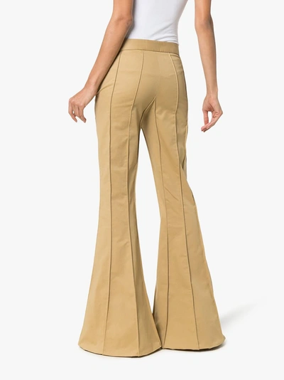 Shop Rosie Assoulin Corduroy Pleated Flare Trousers In Green