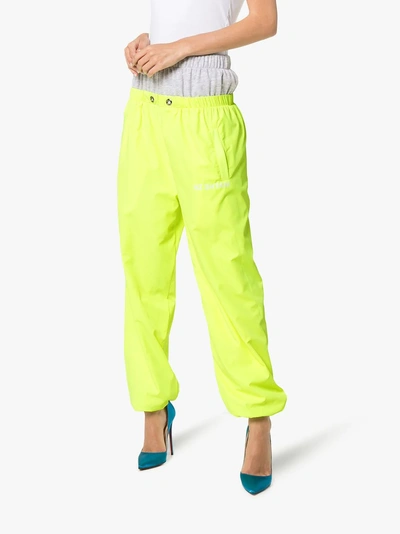 Shop Natasha Zinko Double Layer Logo Print Cotton Track Pants In Yellow/orange