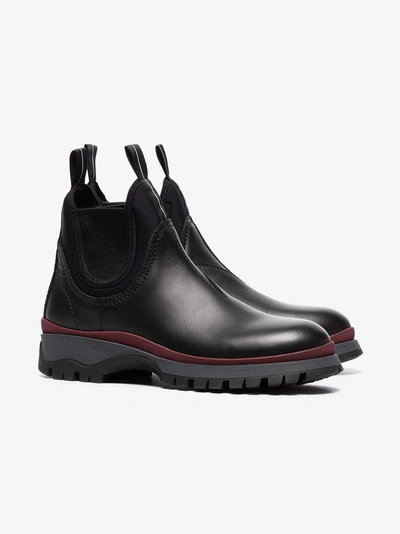 Shop Prada Sawtooth Sole Boots In Black