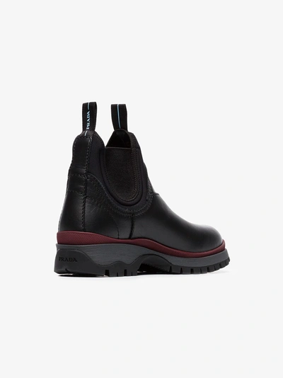 Shop Prada Sawtooth Sole Boots In Black