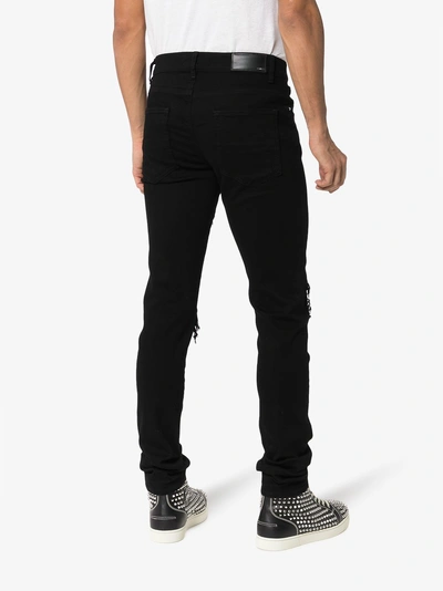 Shop Amiri Bandana Skinny Jeans In Black