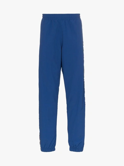 Shop Champion Reverse Weave Logo Stripe Track Pants In Blue