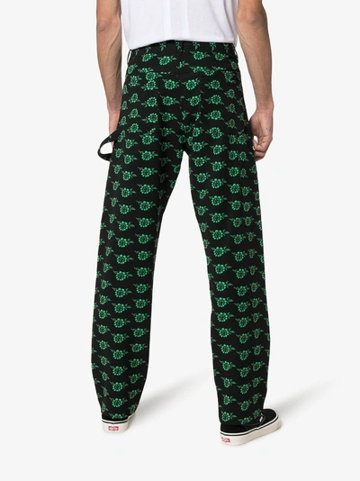 Shop Ashley Williams Rose Print Trousers In Black
