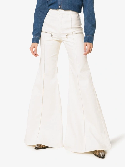 Shop Chloé Zipped Flared Jeans In 115 Dusty White