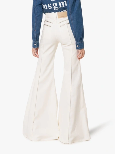 Shop Chloé Zipped Flared Jeans In 115 Dusty White