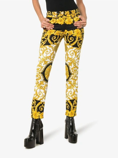 Shop Versace Baroque Low-rise Patterned Skinny Jeans In Black