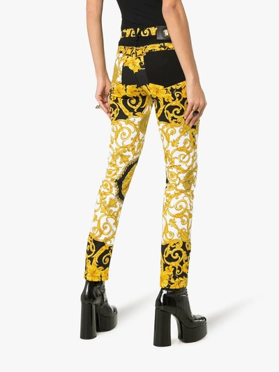 Shop Versace Baroque Low-rise Patterned Skinny Jeans In Black