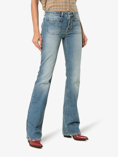 Shop Saint Laurent Button Up Flared Jeans In Blue