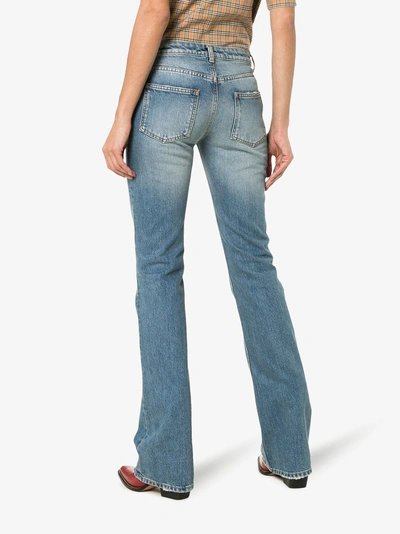 Shop Saint Laurent Button Up Flared Jeans In Blue